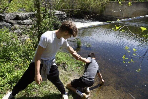 GARDINER, ME - APRIL 18 Gardiner Area High School students release Wednesday May 18, 2022 alewife they examined above a dam on Cobbossee Stream in Gardiner. (Staff photo by Andy Molloy/Staff Photographer)